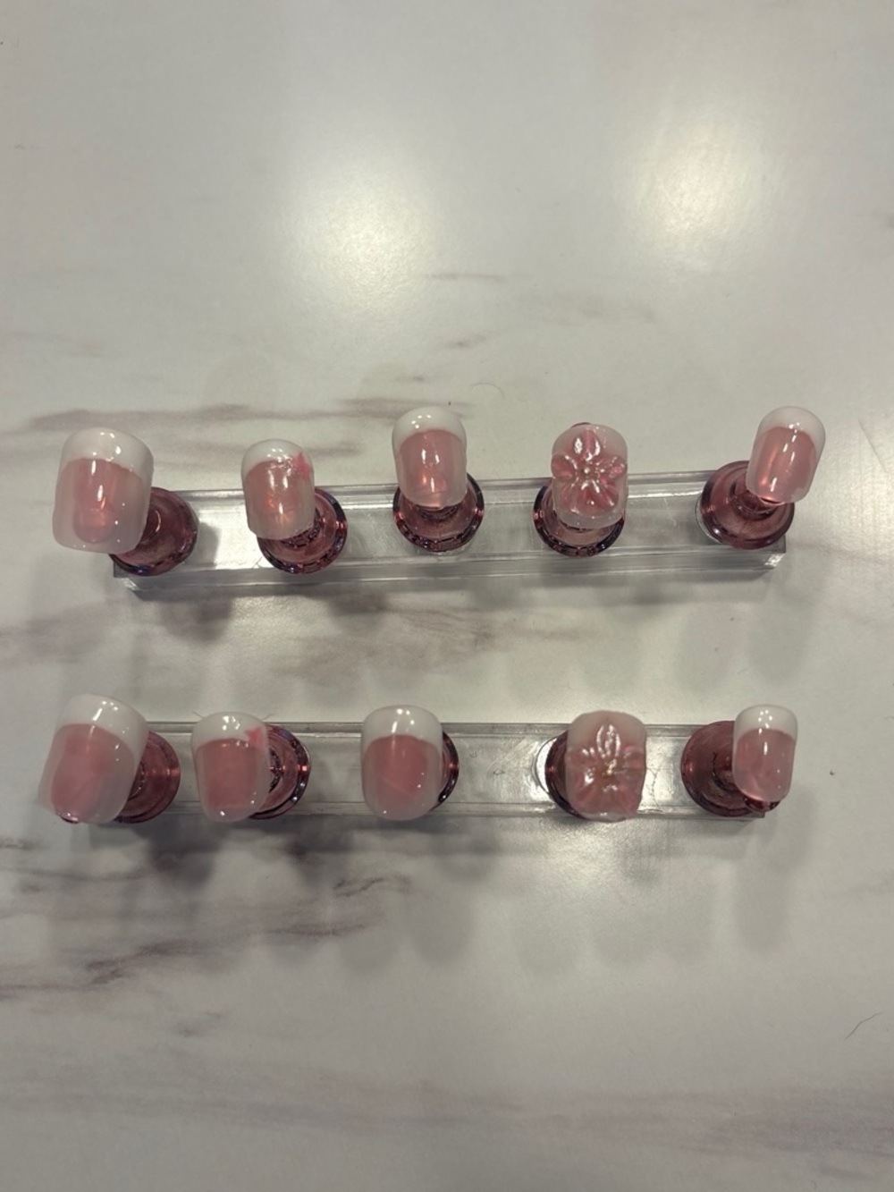 Chic Pink French Tip Press-On Nails with Floral Accent